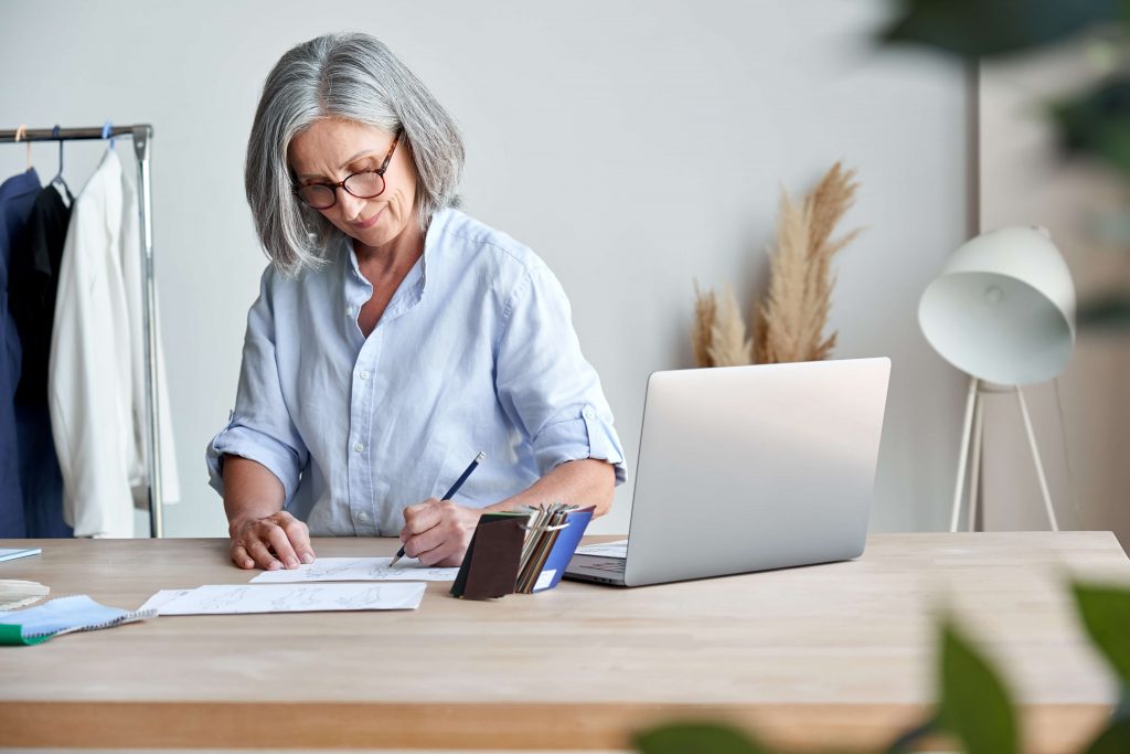 Image of older woman working at desk