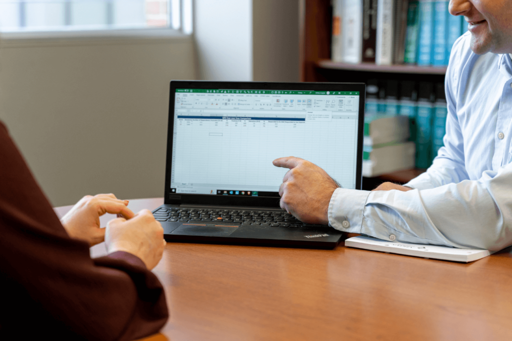 Man pointing to computer screen 