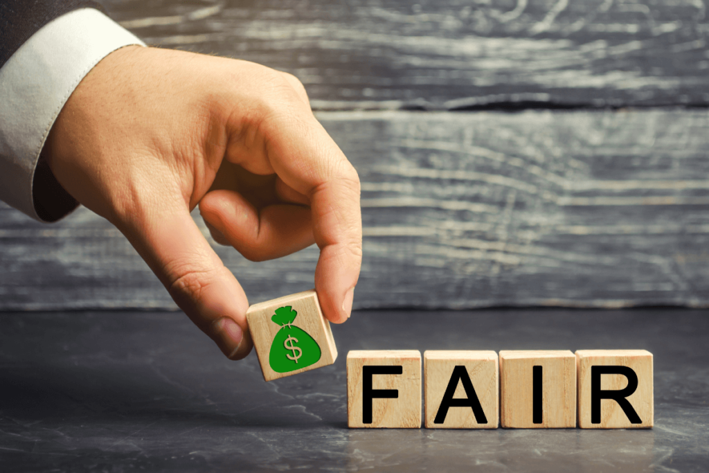 Fair Market Value - man holding FAIR blocks with money