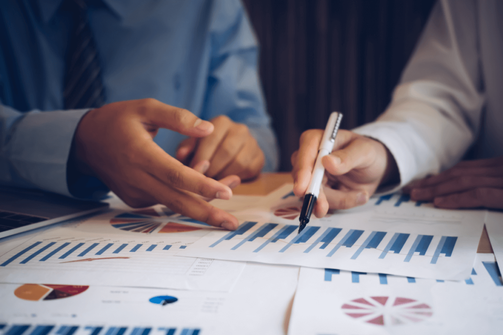 Two people examining financial statements 